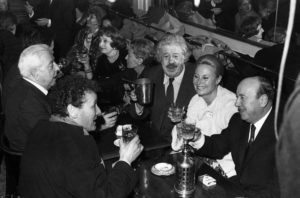 Photo of Jacques Prévert, Michel Simon, Michèle Morgan, Marcel Carné, Jean-Louis Barrault at Les Deux Magots in 1967